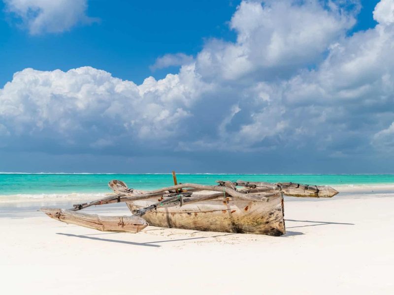 Swahili wooden fishing boat on pristine Matemwe beach Zanzibar Tanzania